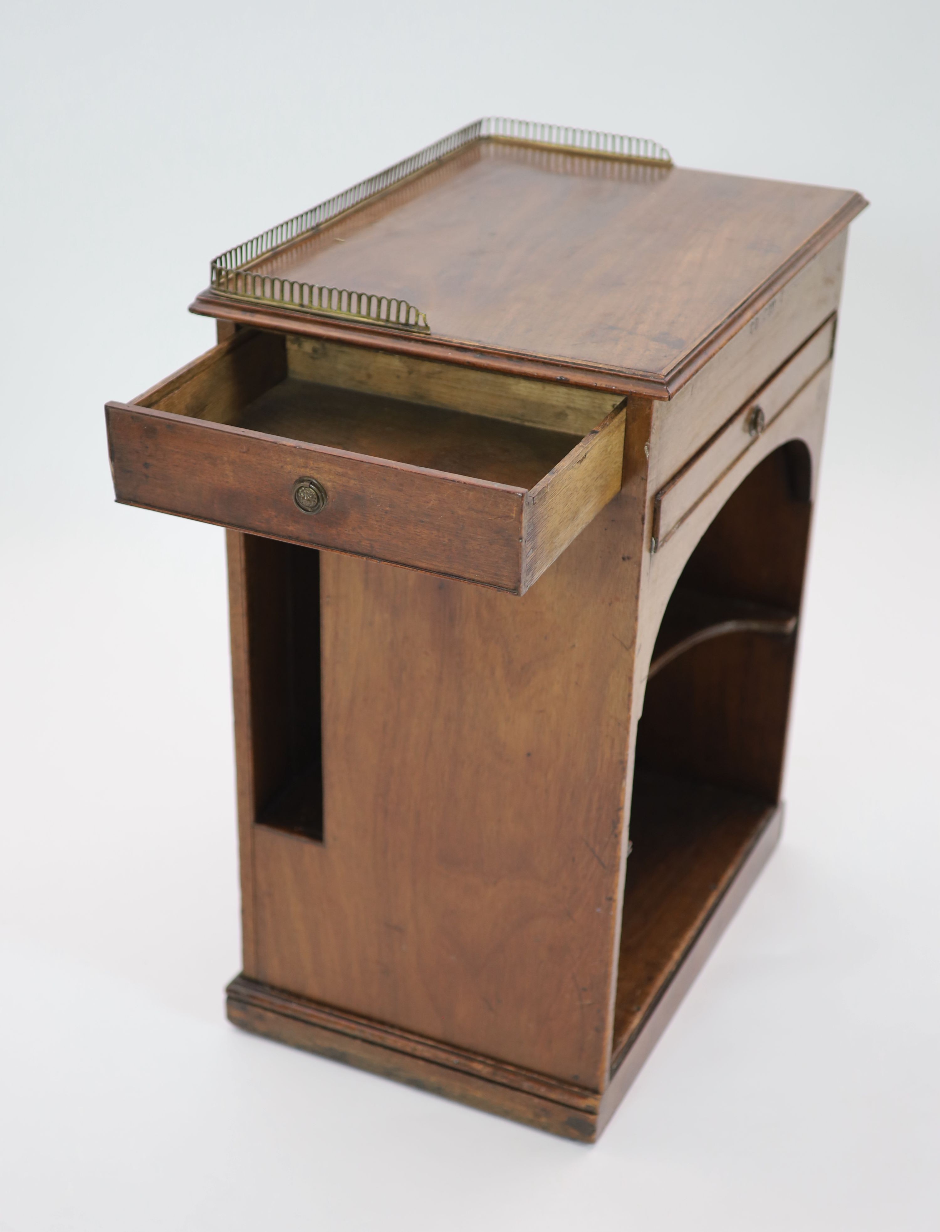 Royal furniture. A William IV mahogany bedside cupboard combined writing chest, H 77cm. W 58cm. D 42cm.